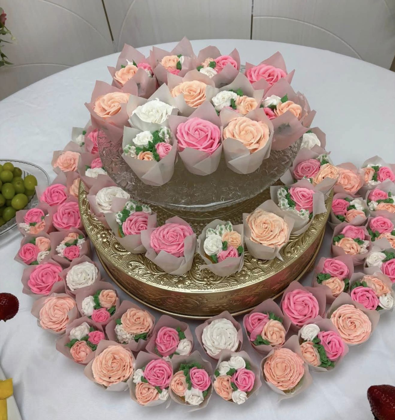 Floral buttercream cupcakes in pink, peach and white